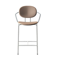 Beige upholstered bar stool with a minimalist chrome frame and curved backrest. Simple and modern design.