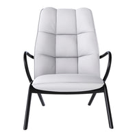 Modern chair featuring a soft white upholstery and sleek black metal frame with a quilted pattern.