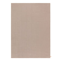 Solid beige area rug with a smooth texture, perfect for neutral color schemes and modern decor.