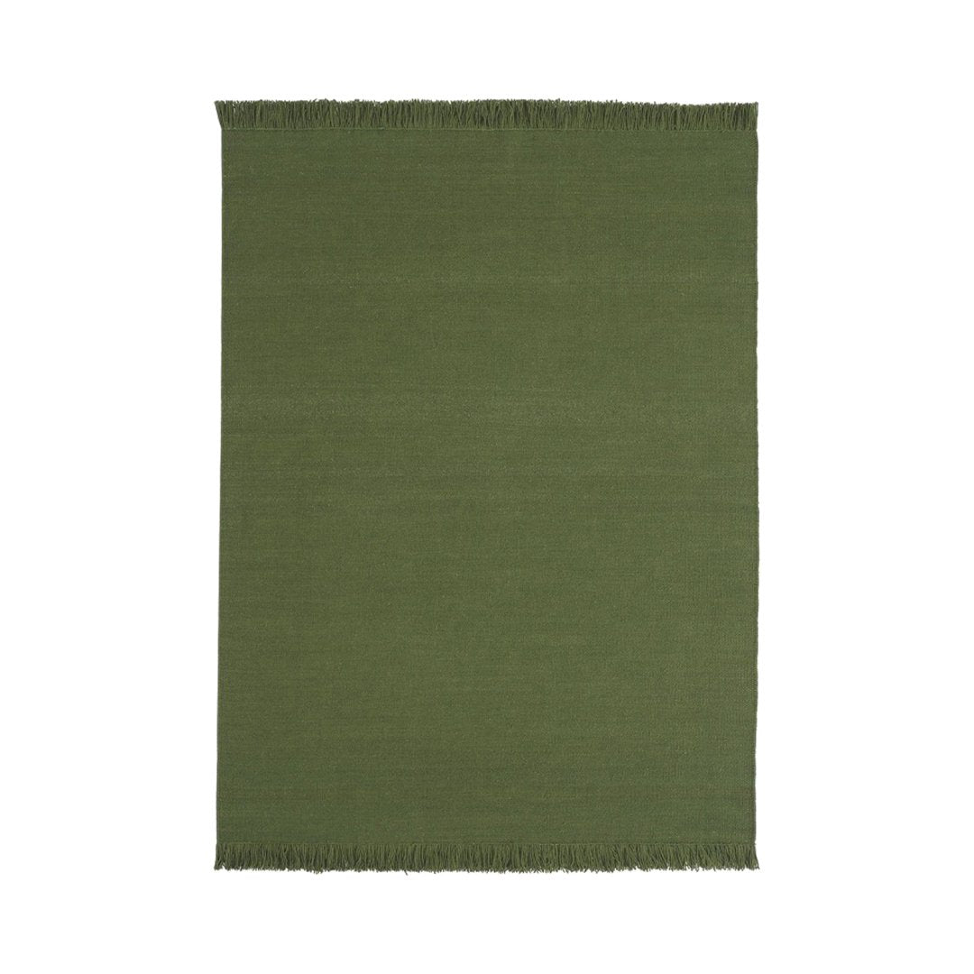 Solid olive green area rug with fringe edges, perfect for adding a touch of nature-inspired elegance to any space.
