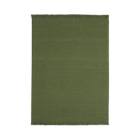 Solid olive green area rug with fringe edges, perfect for adding a touch of nature-inspired elegance to any space.