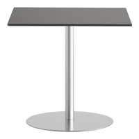 Sleek black rectangular tabletop with a silver circular base, perfect for modern decor.