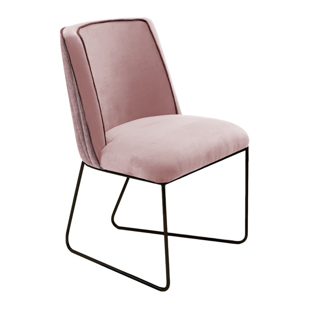 Stylish pink velvet chair with sleek black metal legs, featuring a modern design and smooth, minimalist pattern.
