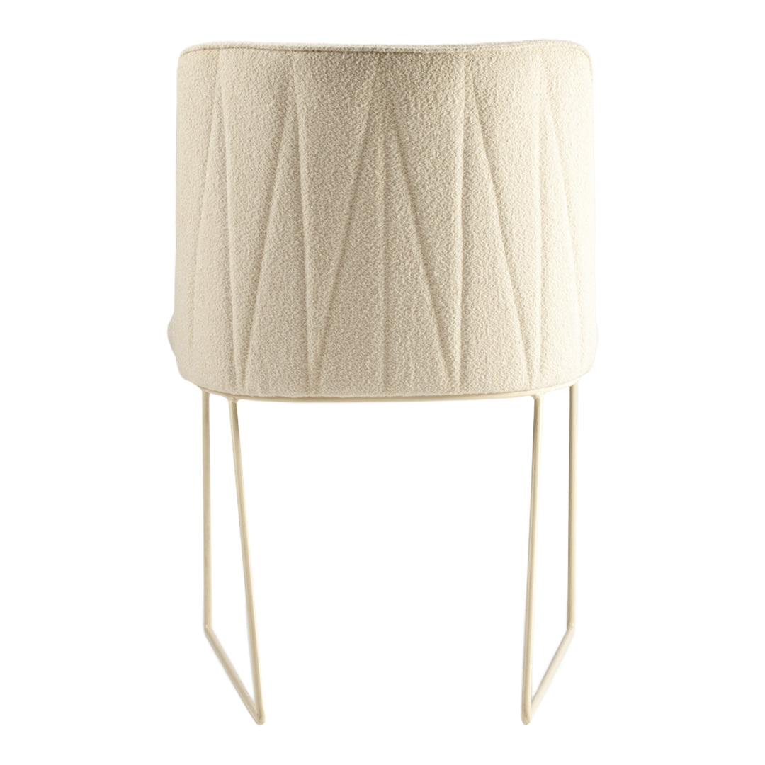 Textured beige planter with vertical seam patterns on a white metal stand, perfect for modern decor.