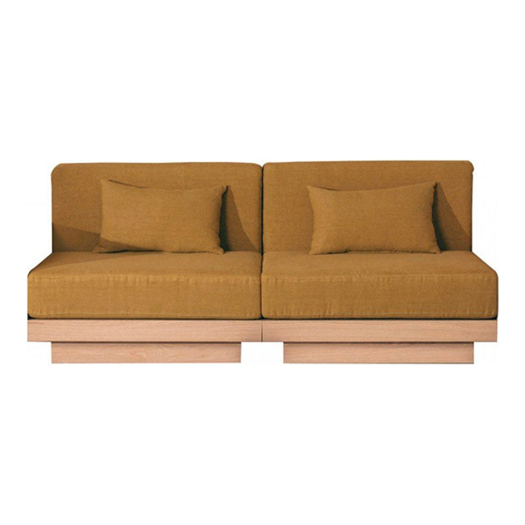 Stylish mustard-yellow sofa with a modern, minimalist design and smooth textured fabric, complemented by wooden base.