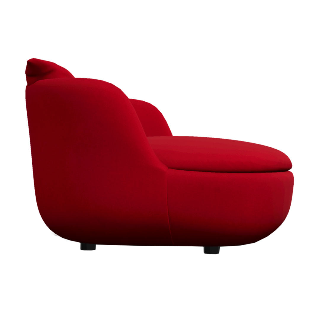 Vibrant red plush chair with a smooth, rounded design and minimalist profile. Perfect for modern interiors.