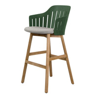 Green slatted bar chair with a gray cushioned seat and natural wood legs. Modern design with a fresh color palette.