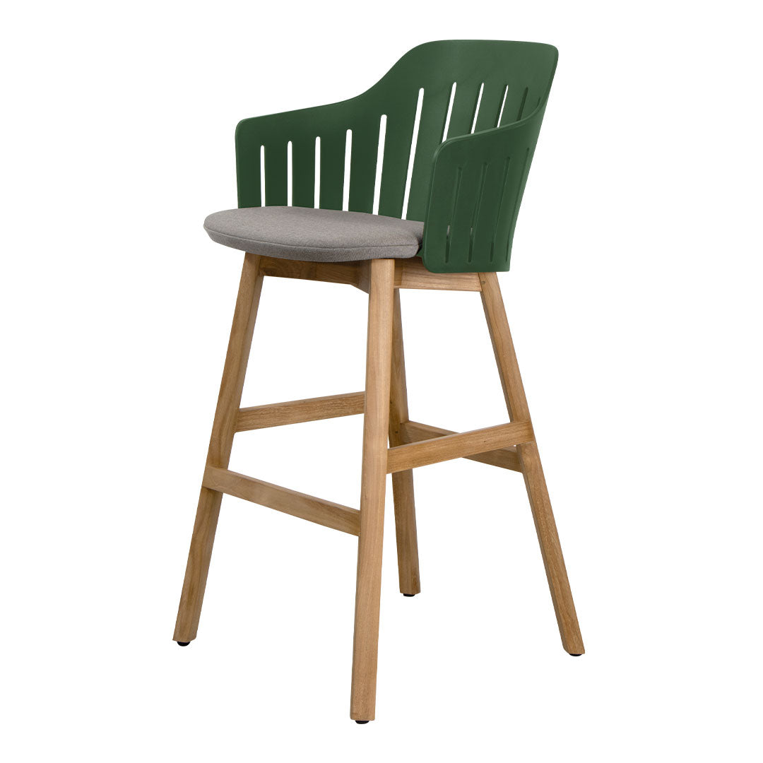 Green slatted back bar stool with gray seat cushion and natural wood legs. Modern, stylish design for any space.