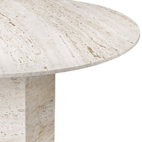Cream-colored round marble table with subtle beige veining and polished finish, ideal for modern decor.