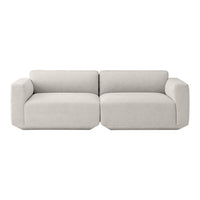 Light gray modern sofa with a minimalist design, featuring smooth, solid fabric and clean lines.