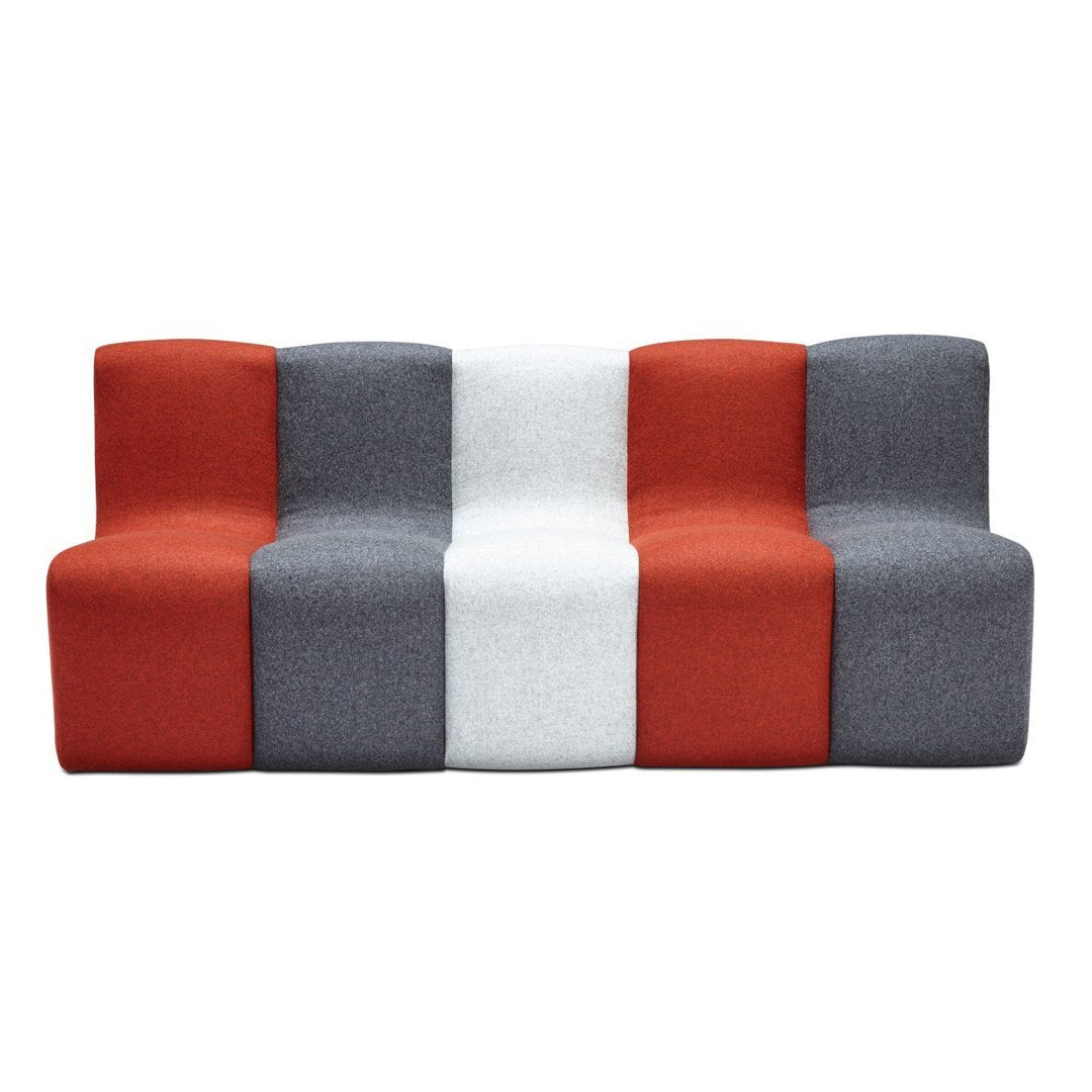 Modern three-section sofa featuring a bold color scheme of red, gray, and white with a geometric pattern.