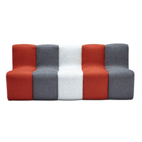 Modern three-section sofa featuring a bold color scheme of red, gray, and white with a geometric pattern.