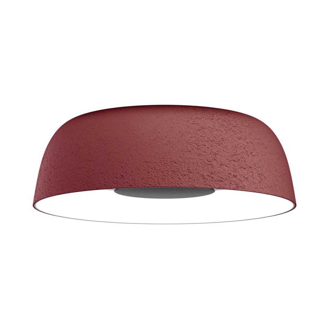 Rustic red ceiling light with a textured finish and sleek, minimal design, perfect for modern interiors.