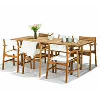 Wooden dining table set with natural brown tones and white cushions, featuring a clean, modern design.
