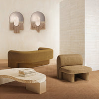 Stylish brown furniture with textured patterns set against a soft, neutral backdrop. Elegant, earthy tones enhance the space.
