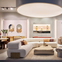 Modern interior featuring soft beige, pastel pink, and vibrant earth-toned accents with textured patterns.
