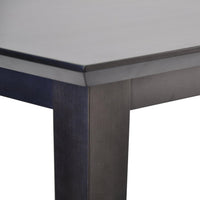Dark wood table corner with a smooth, sleek finish and subtle grain pattern. Modern and elegant design.
