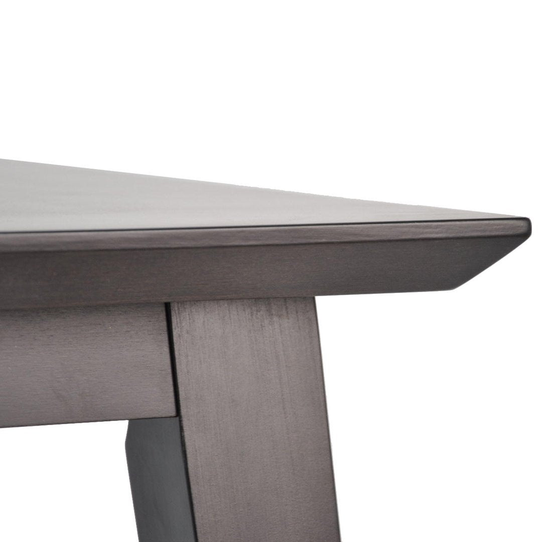 Dark gray wooden table edge with a smooth, sleek finish and clean lines.