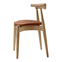 Light oak chair with a smooth, natural finish and a warm terracotta seat, featuring minimalist design and clean lines.