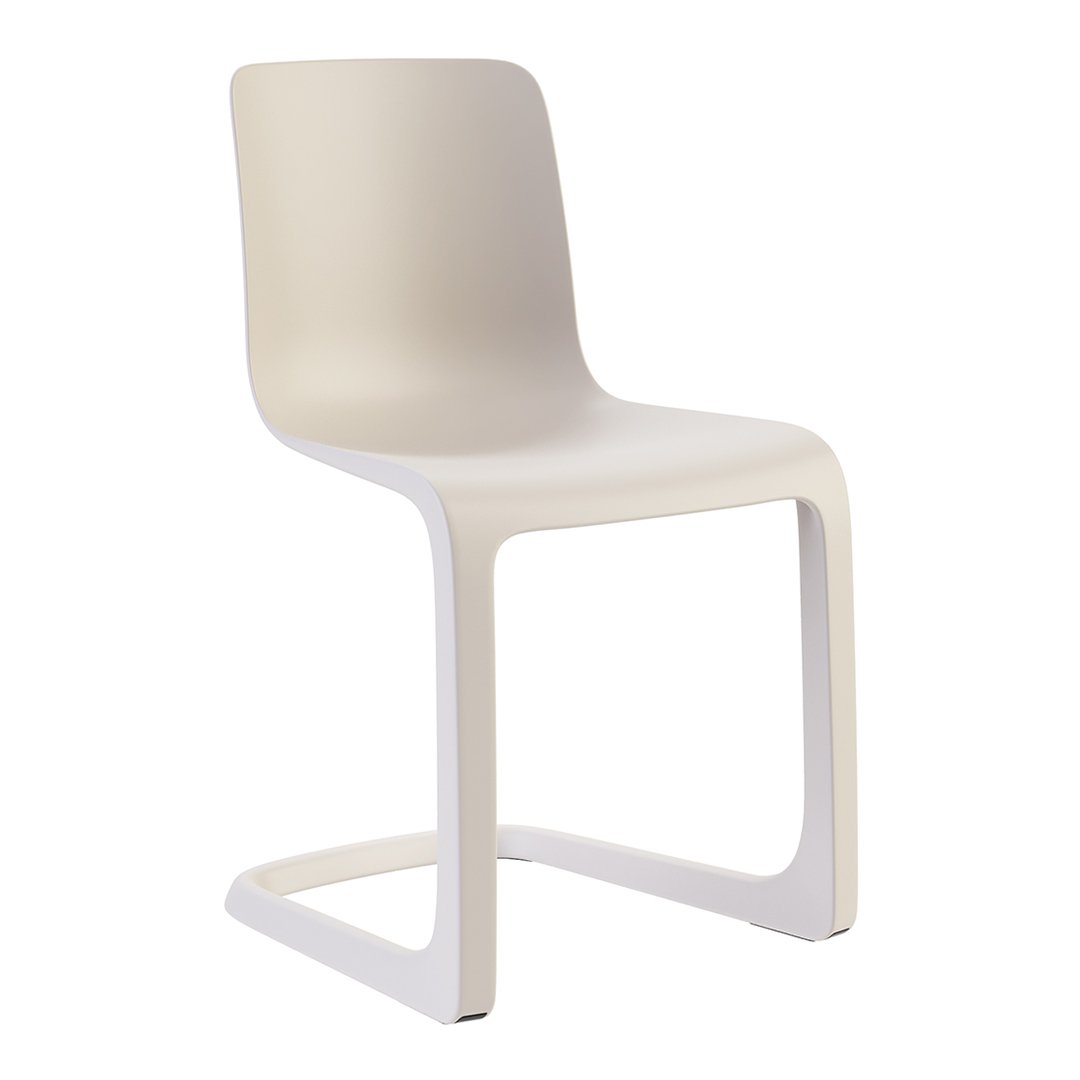 Light beige chair with a sleek, minimalist design and smooth, solid surface. Perfect for modern decor.