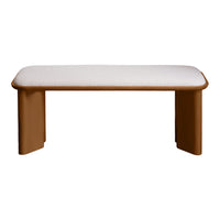 Brown upholstered bench with a smooth white cushion top and rounded edges, perfect for modern decor.