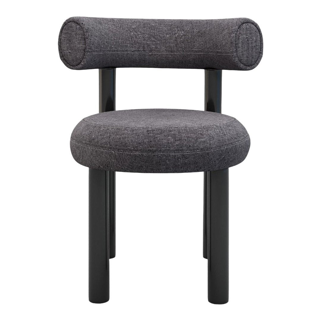Gray upholstered chair with cylindrical backrest and black wooden legs, featuring a smooth, minimalist design.