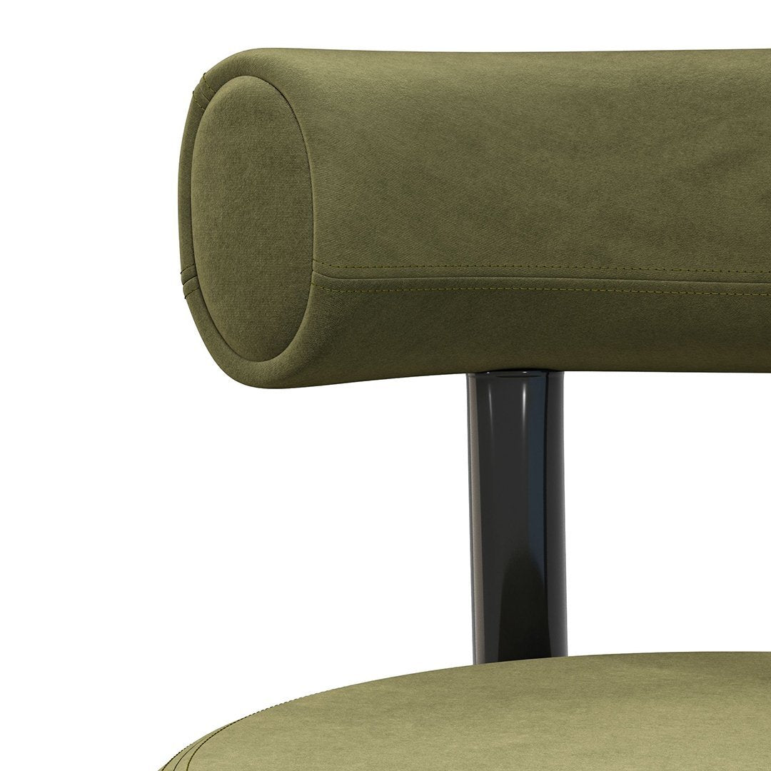 Olive green texture with smooth surfaces and black metal accents, showcasing modern minimalist design.