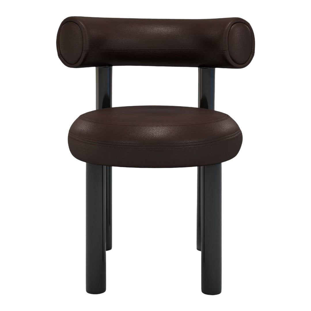 Brown leather chair with a rounded backrest and sleek black legs, offering a modern and stylish design.