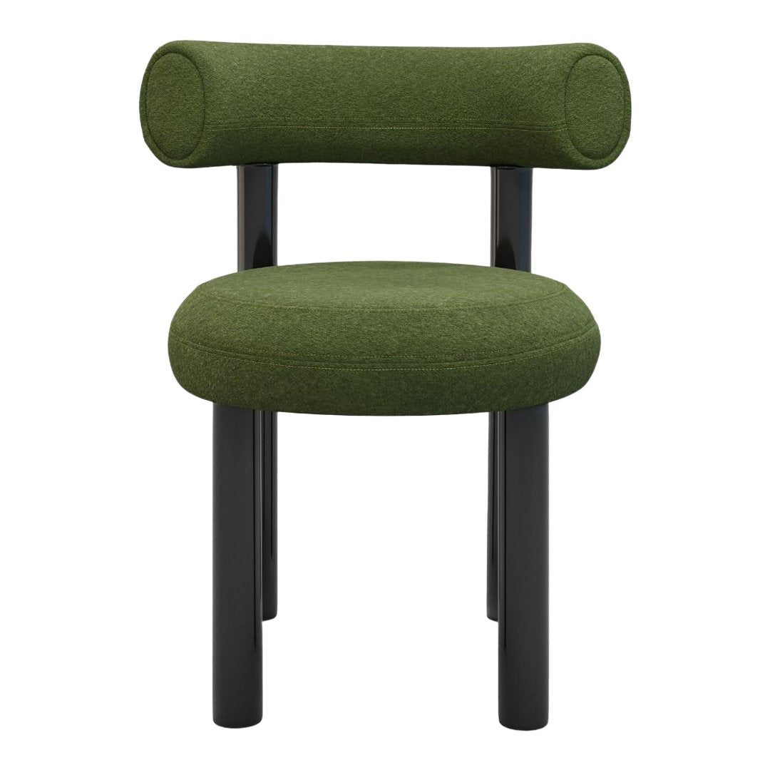 Green upholstered chair with circular backrest and black wooden legs, featuring a minimalist design.