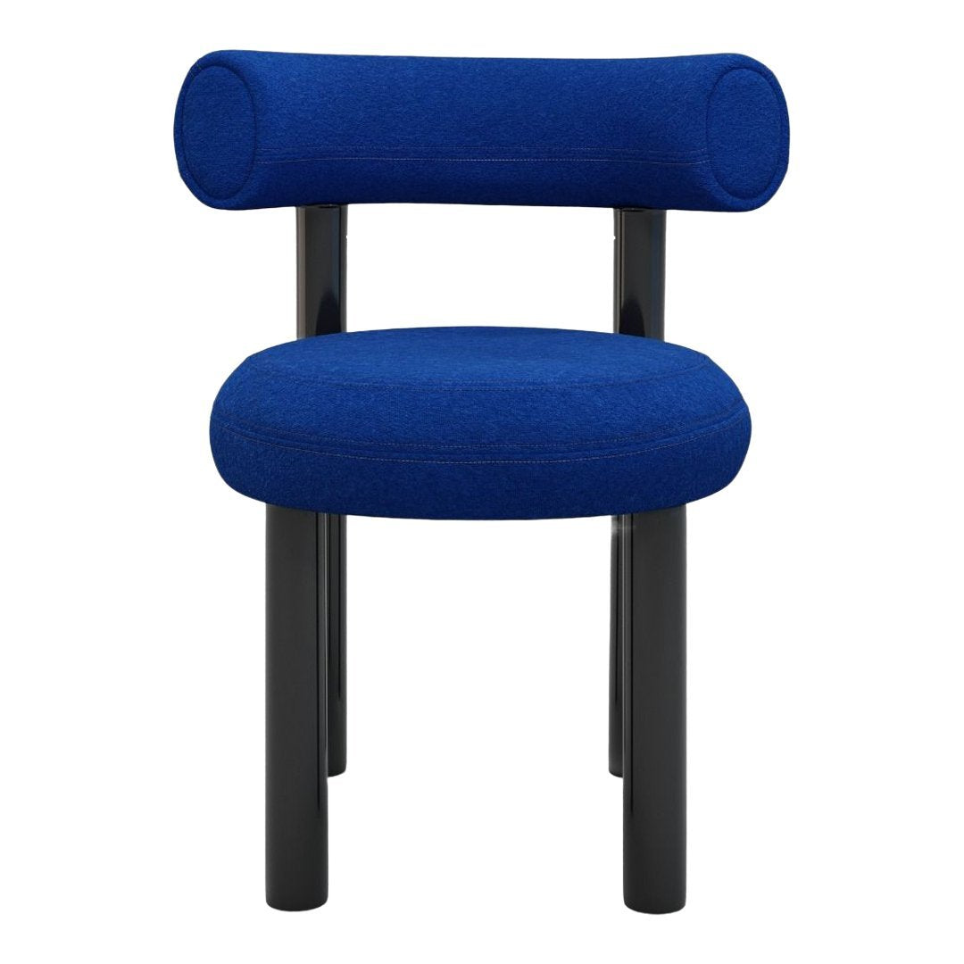 Vibrant blue upholstered chair with black legs and rounded armrests, featuring a smooth, modern design.