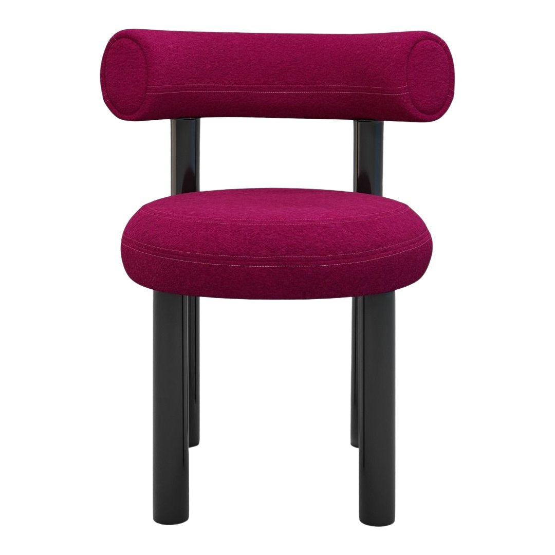 Fuchsia upholstered chair with black legs, featuring a smooth round seat and tubular backrest design.