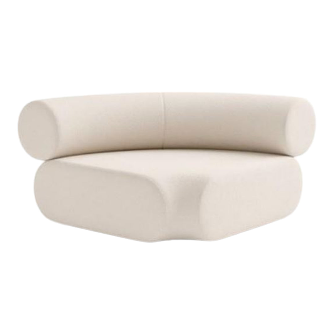 Cream-colored curved sofa with a minimalist design and smooth, rounded shapes. Ideal for modern decor.