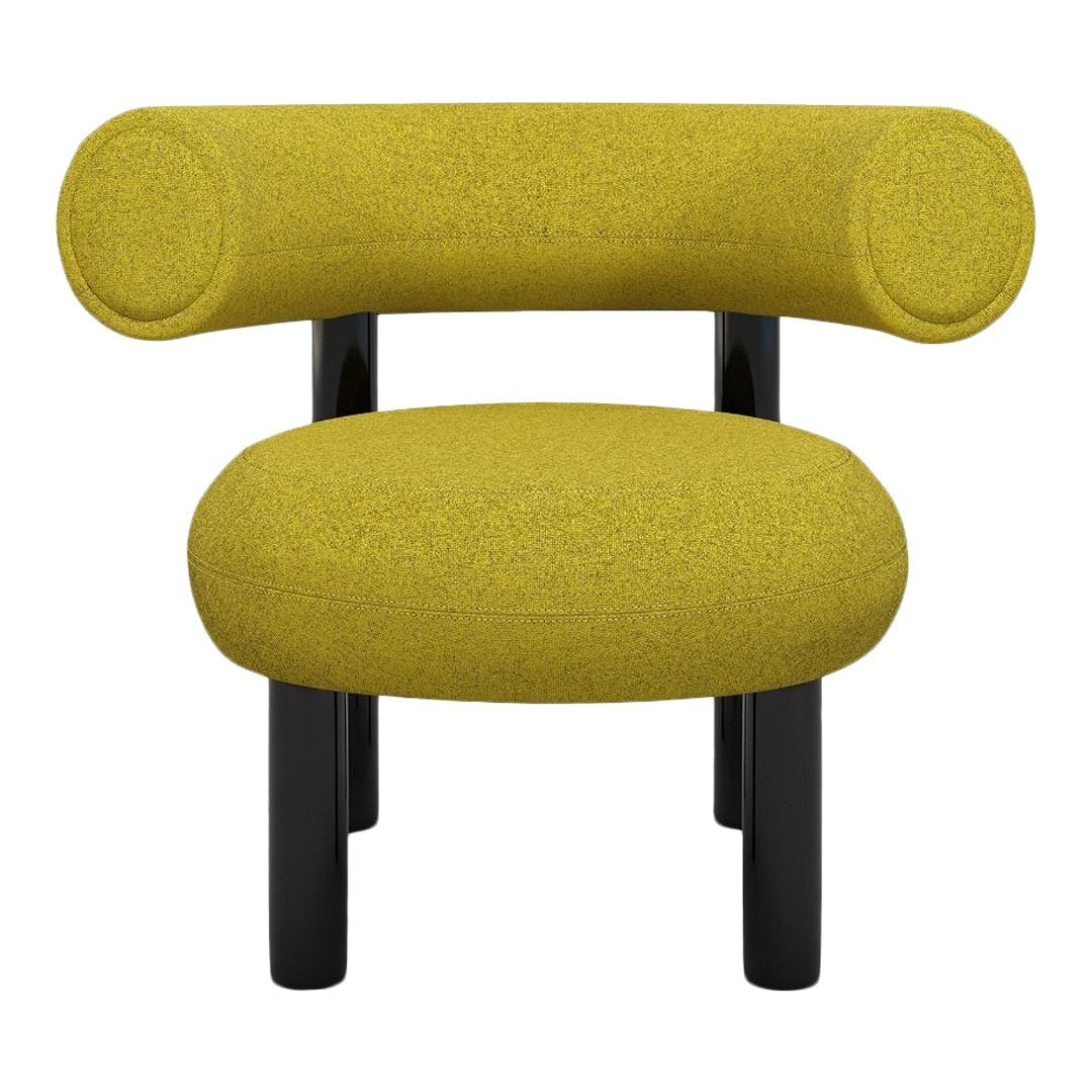 Stylish chair with a vibrant yellow fabric and sleek black legs, featuring a modern, minimalist design.