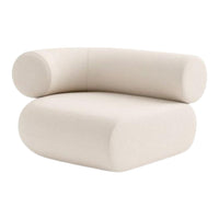 Beige, modern chair with rounded edges and a minimalist design, featuring a soft, textured upholstery.