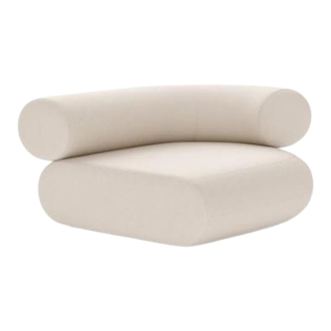 Beige curved sofa with a modern, minimalist design featuring soft, rounded edges and a smooth texture.