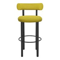 Yellow upholstered bar stool with a modern cylindrical design and black metal legs. Perfect for contemporary spaces.