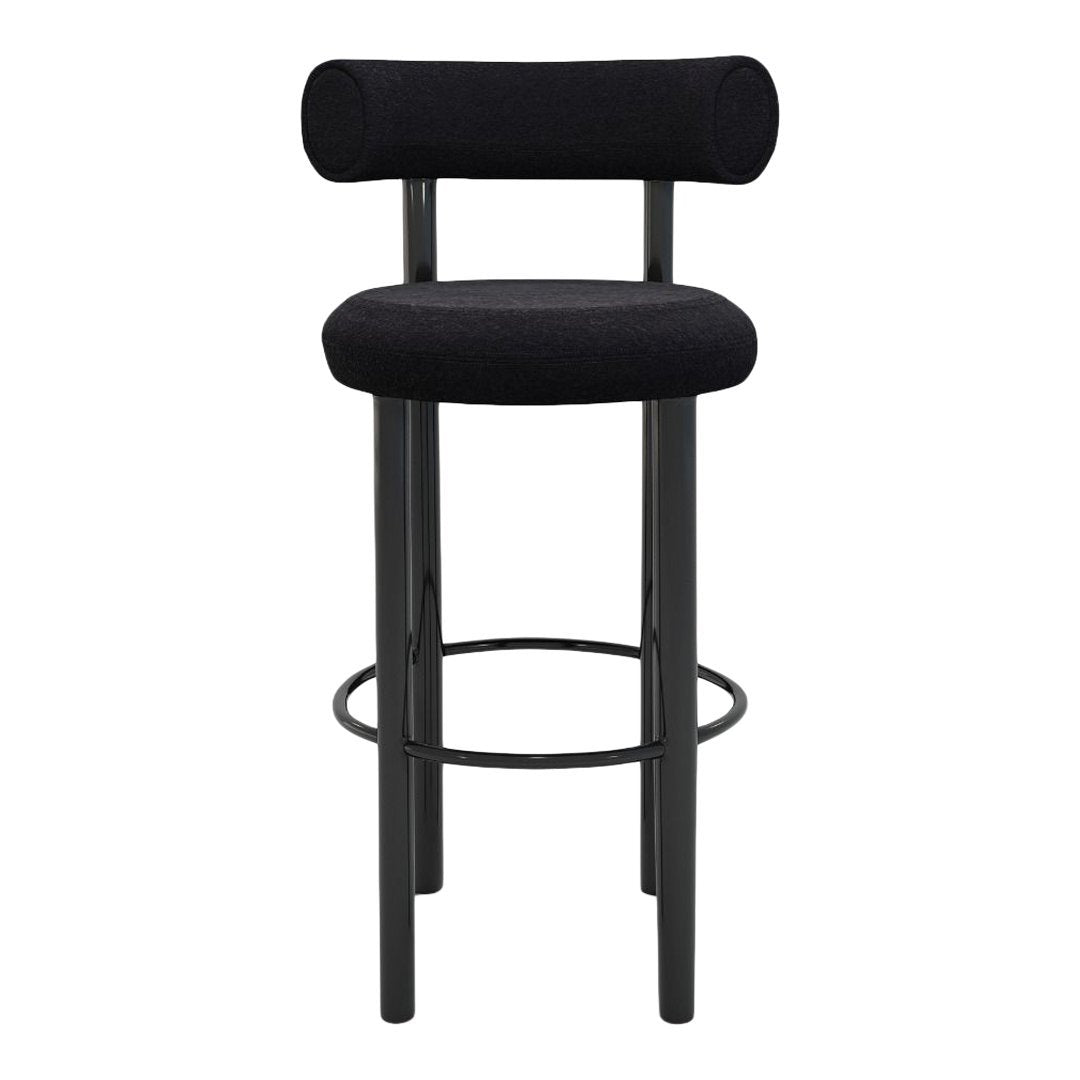 Black bar stool featuring a textured fabric seat and backrest with minimalist black metal legs.