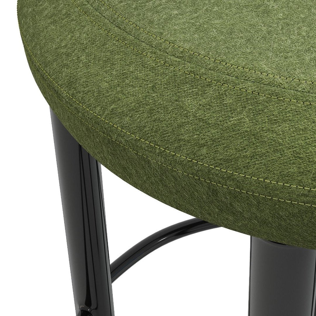 Green upholstered round stool cushion with black metal legs and subtle stitching detail.
