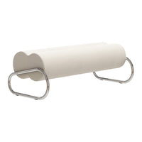 Cream cylindrical bench with a smooth texture and sleek chrome legs, perfect for modern home decor.