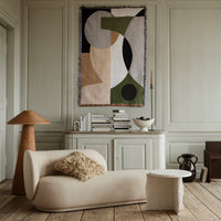 Abstract wall tapestry featuring muted tones of beige, green, black, and white with geometric shapes and patterns.