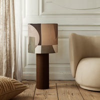 Mid-century table lamp with geometric patterns in soft browns, taupe, and olive green. Ideal for modern decor.
