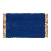 Bold blue rectangular rug with textured weave and tassel fringe. Ideal for adding color and style to any space.