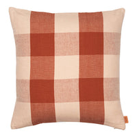 Rustic terracotta and cream checkered pattern pillow, perfect for cozy home decor accents.