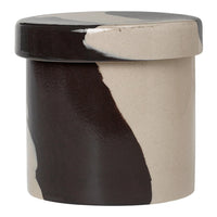 Multicolored ceramic storage jar featuring abstract black, beige, and white patterns and a smooth finish.