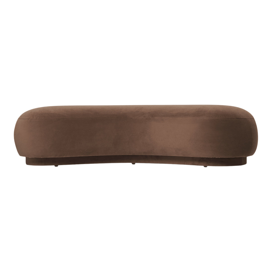 Soft brown, curved velvet bench with a smooth, solid color design, ideal for modern decor.