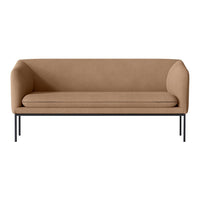 Tan upholstered sofa with a smooth finish and sleek black metal legs. Modern design for any living space.