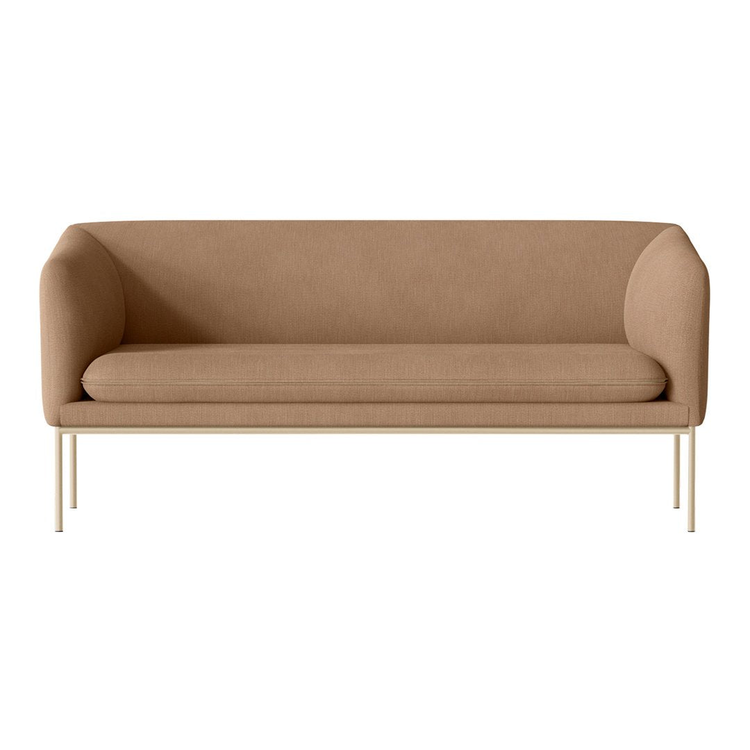Tan upholstered sofa with smooth, modern lines and minimalist metal legs, perfect for contemporary decor.