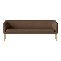 Brown upholstered sofa with sleek gold legs, featuring a minimalist design and smooth, solid color.