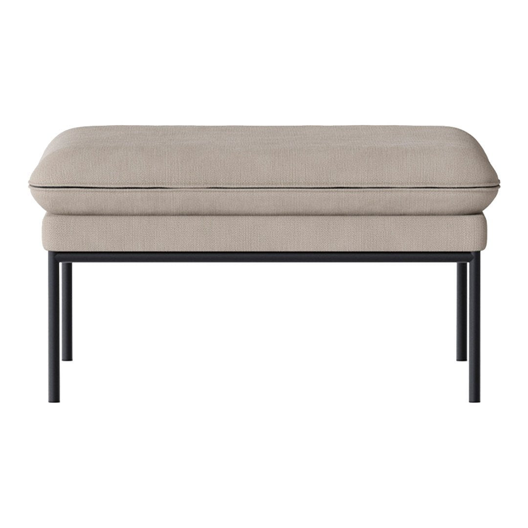 Beige upholstered ottoman with a sleek black metal frame, featuring a smooth, minimalist design.