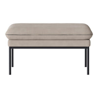Beige upholstered ottoman with a sleek black metal frame, featuring a smooth, minimalist design.